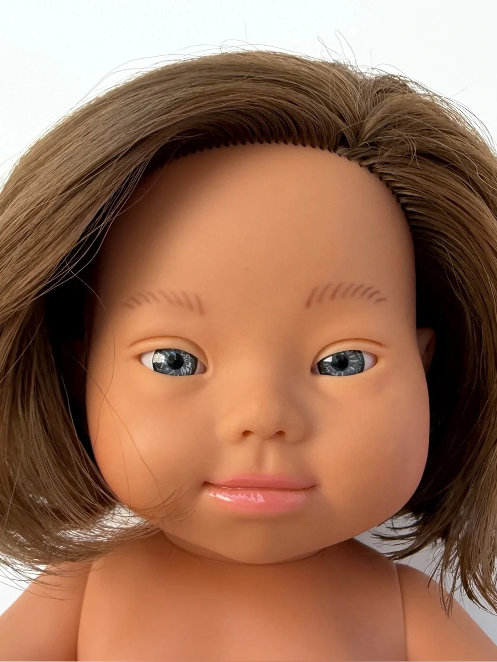 Miniland Doll 15'' Caucasian Brunette Girl with Down Syndrome in Muslin Dress